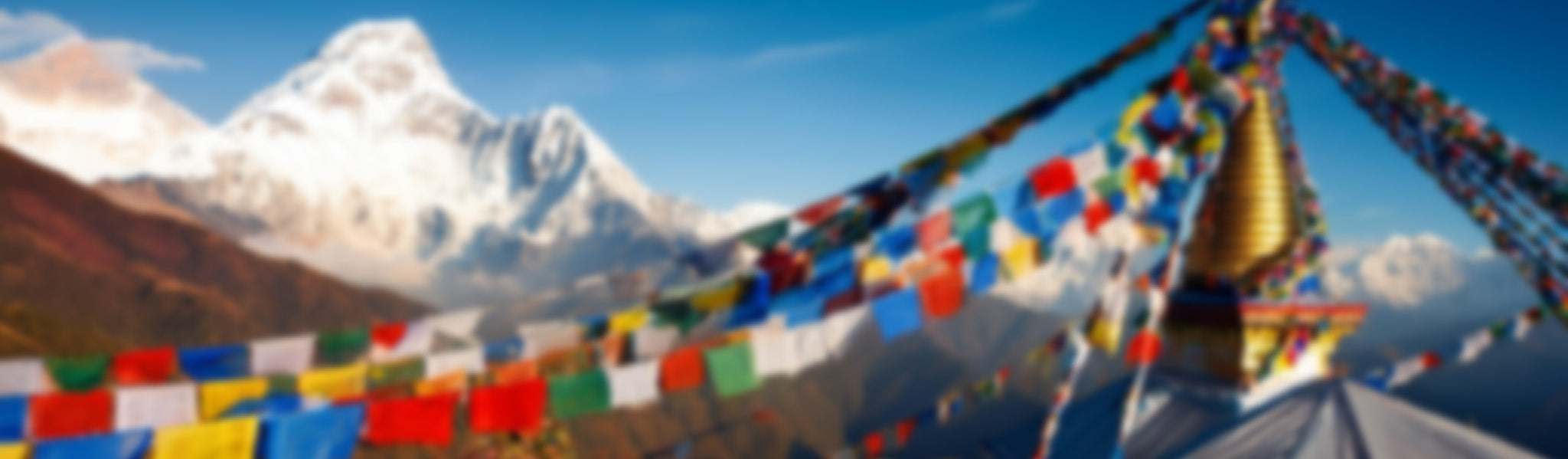 Kokroma Teens Clothing, Colorful prayer flags with a mountain and stupa in the background